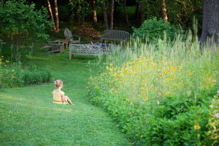 There’s no need to worry children running barefoot and rolling around in the yard. This garden is chemical free. Here, the owners’ granddaughter takes a rest in the mown path. Before Lorenz installed this garden, this area flooded frequently. “The bottom of the hill used to become a swamp when it rained,” he said. “Now the meadow drinks up a considerable amount of water, as do the native trees we planted in the woodland like bald cypress, red maple, river birch, as well as an array of shrubs and understory plants.” As a result, it’s also cut back considerably on mosquitos.